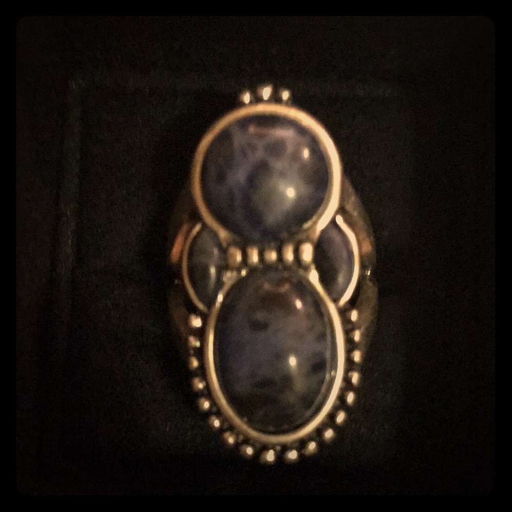 Silver rings with blue stones.